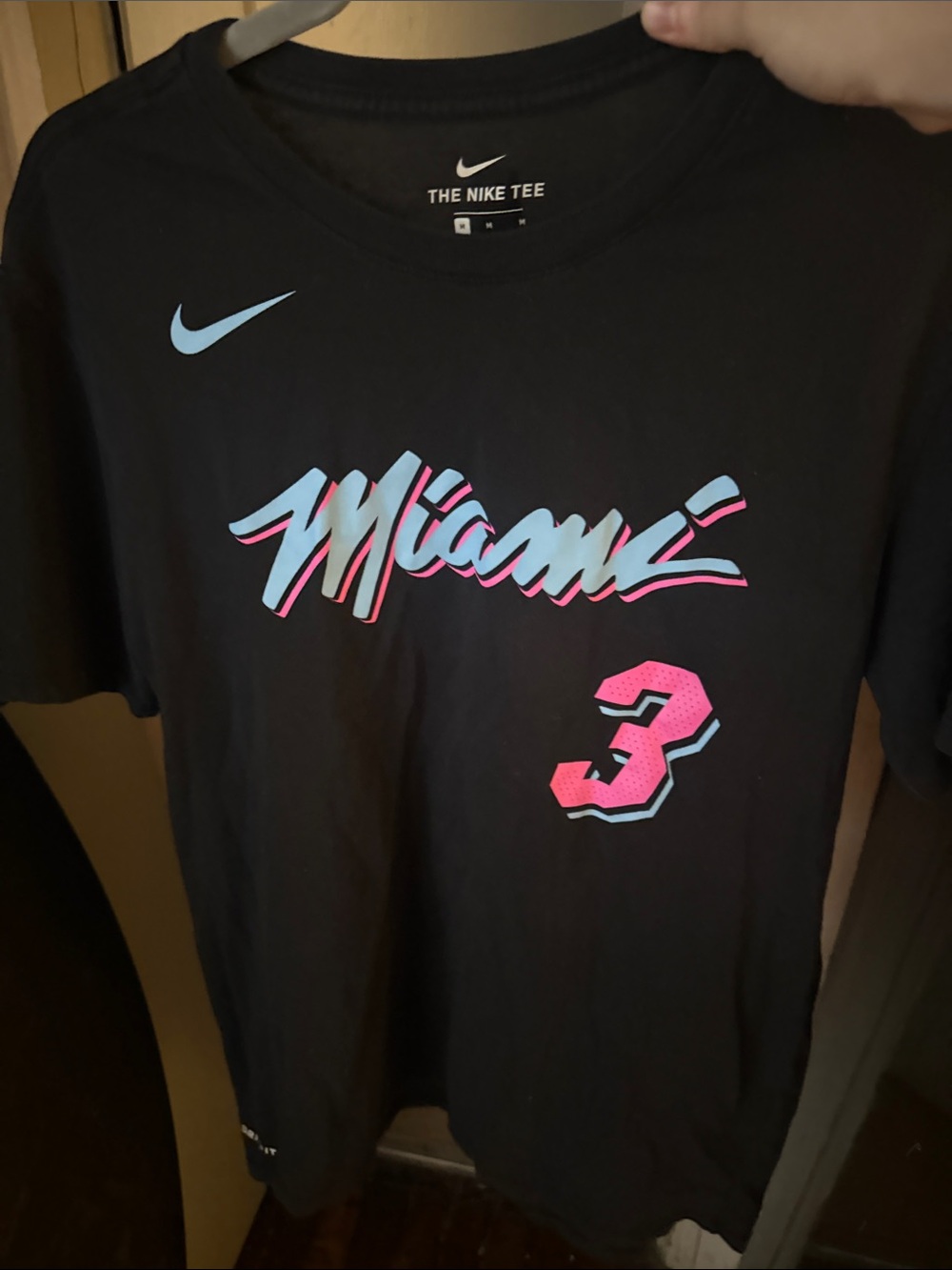 The Nike Tee Dri-Fit Menโs Black Miami D Wade #3 Graphic Tee